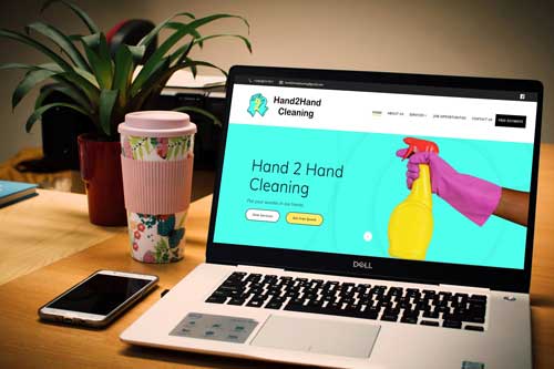 Hand2Hand Cleaning website on desktop computer.