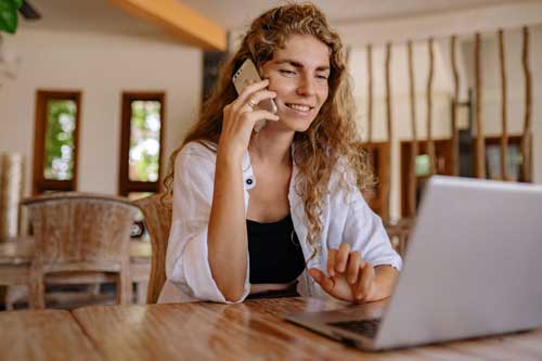 Woman smiling during website consultation.